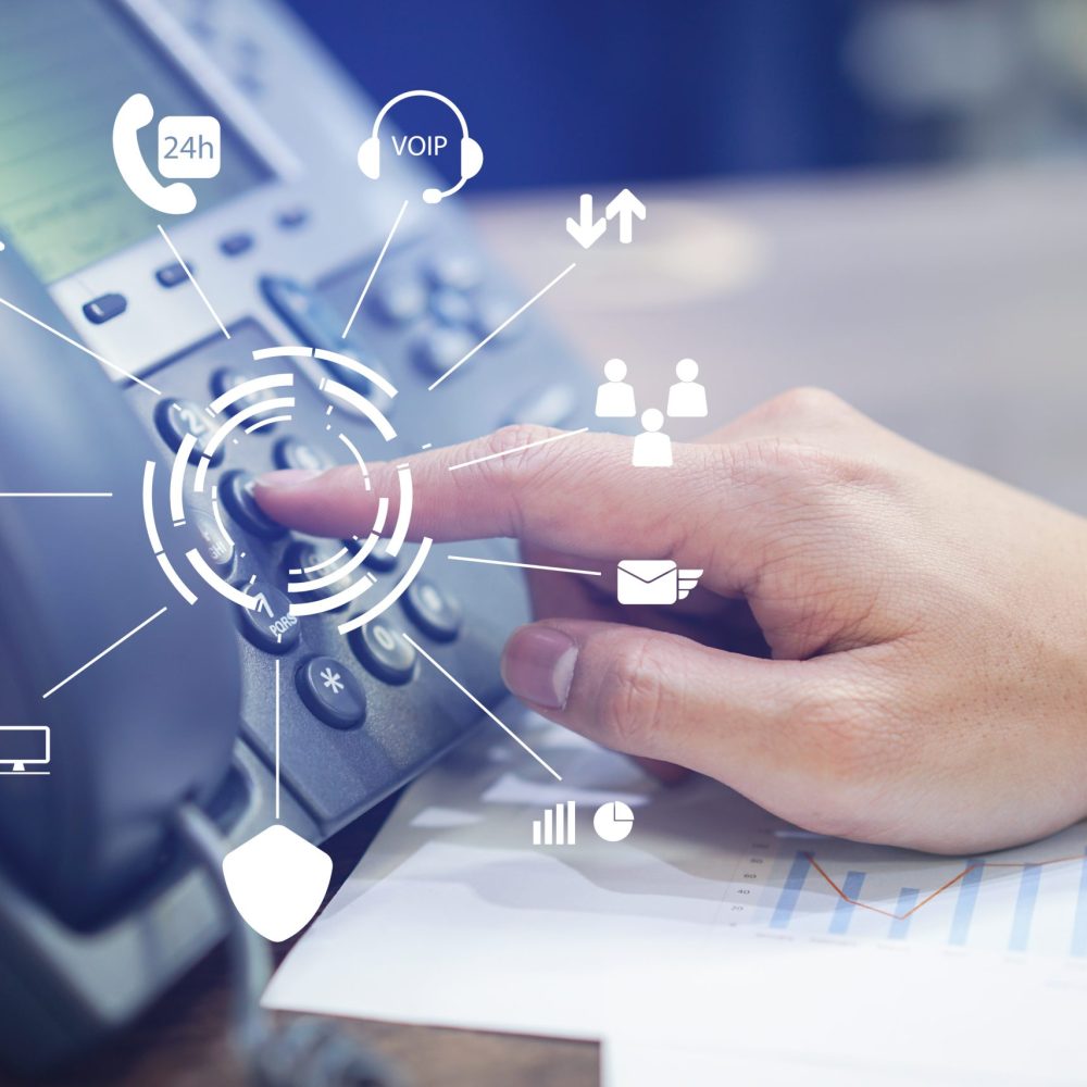 close up employee man hand press number on telephone for contact